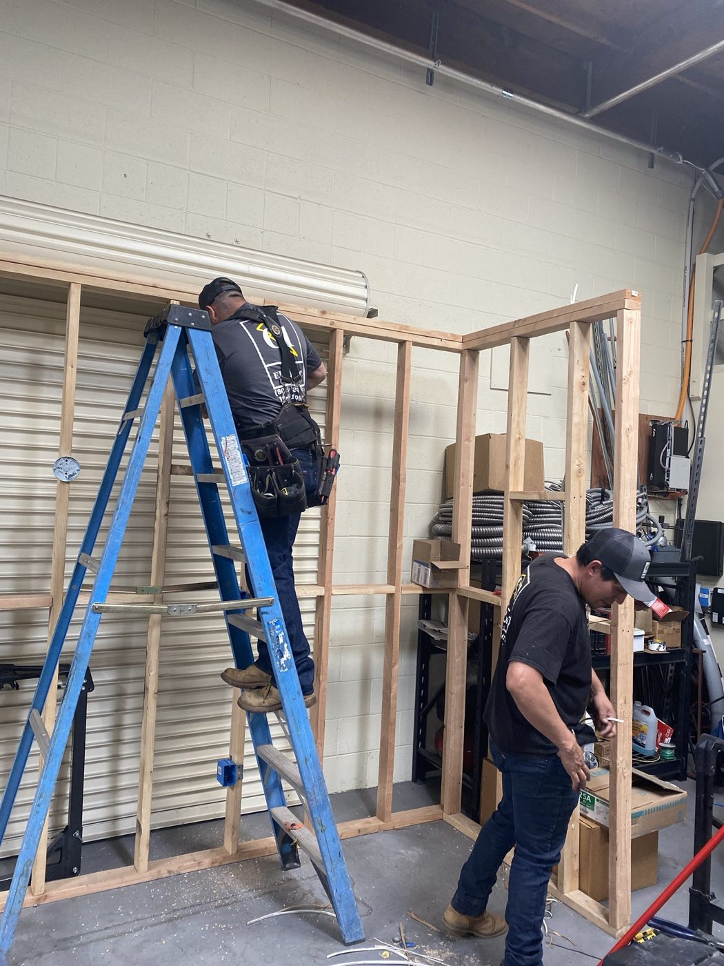 C1 crew working on the shop training wall