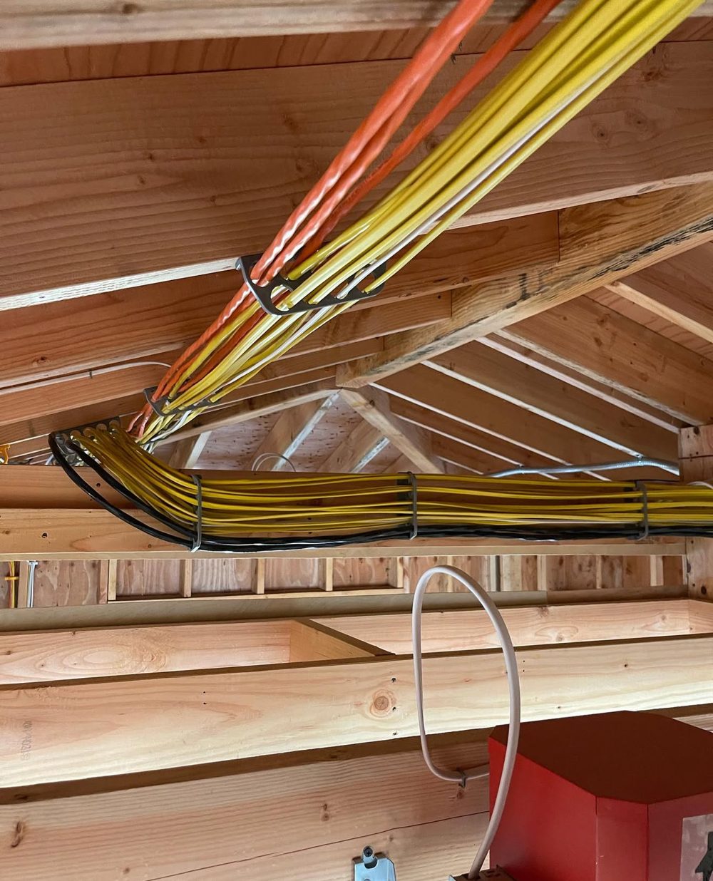 Organized home runs bundled across ceiling framing